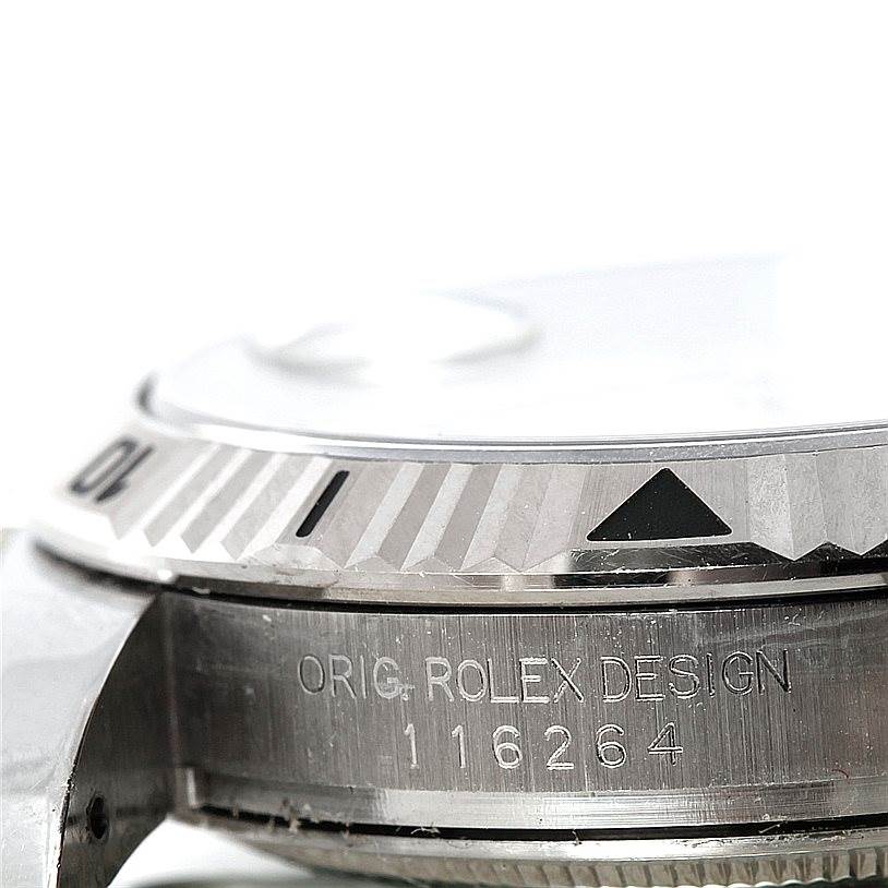 This image shows a close-up side angle of the bezel and case edge of the Rolex Turn-o-Graph 116264 Men's Stainless Steel White Dial 116264 Men's Stainless Steel White Dial watch, highlighting the engravings and markings.