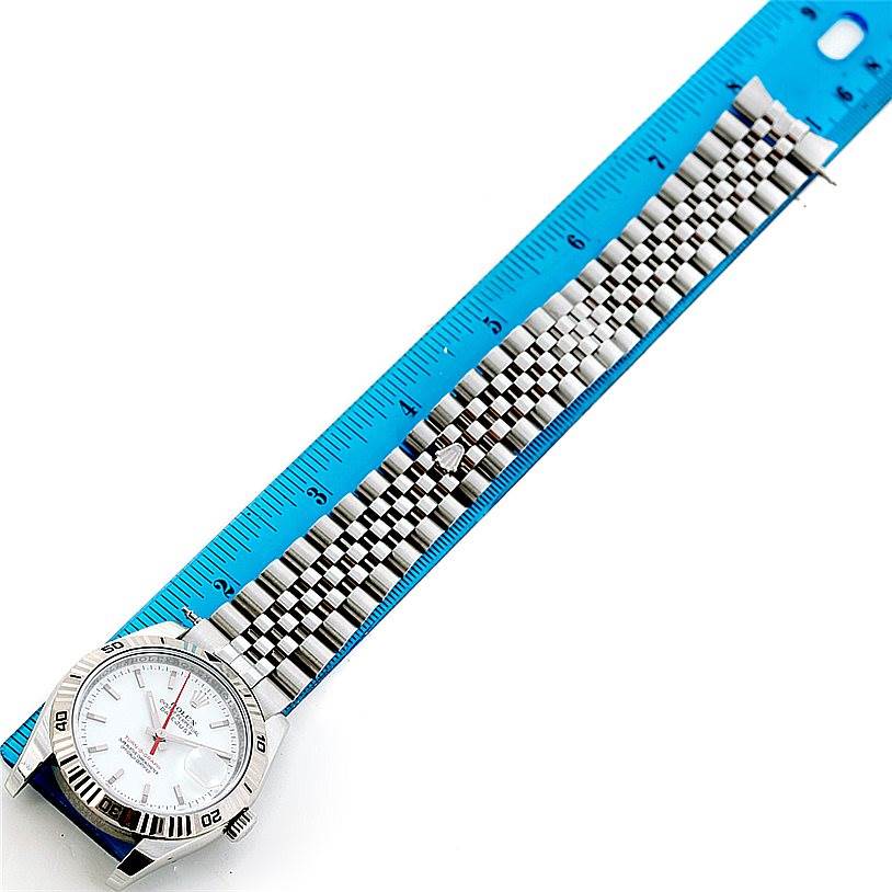 The image shows a Rolex Turn-o-Graph 116264 Men's Stainless Steel White Dial 116264 Men's Stainless Steel White Dial model watch from an overhead angle, featuring the watch face, bezel, and a portion of the strap measured by a ruler.