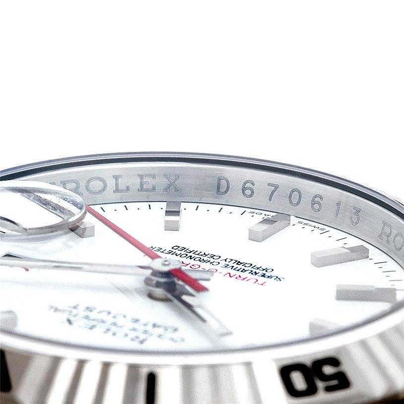 This image shows a close-up of the dial, bezel, and serial number of a Rolex Turn-o-Graph 116264 Men's Stainless Steel White Dial 116264 Men's Stainless Steel White Dial watch at a low angle.