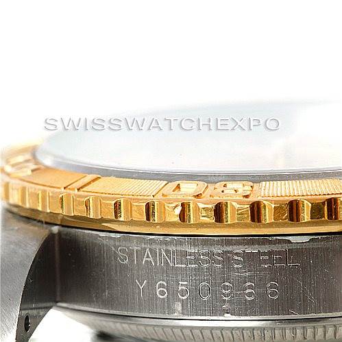 This image shows a close-up of the Rolex Turn-o-Graph 16263 Men's Steel and Gold (two tone) Champagne Dial 16263 Men's Steel and Gold (two tone) Champagne Dial watch case, highlighting the gold bezel and stainless steel side with engraving.