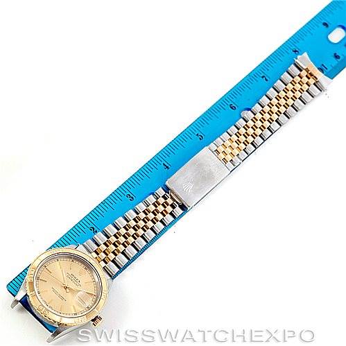 The image shows a Rolex Turn-o-Graph 16263 Men's Steel and Gold (two tone) Champagne Dial 16263 Men's Steel and Gold (two tone) Champagne Dial watch laid flat alongside a blue ruler, displaying the watch face and full bracelet.