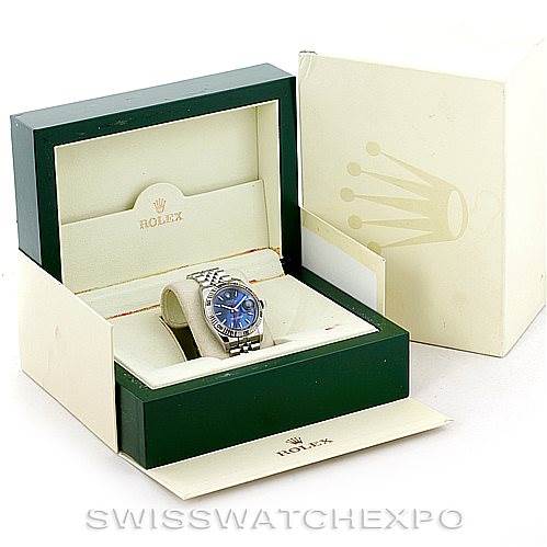 The Rolex Turn-o-Graph 116264 Men's Stainless Steel Blue Dial 116264 Men's Stainless Steel Blue Dial watch is shown from a front angle inside an open green and cream Rolex box.