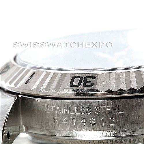 This close-up image of the Rolex Turn-o-Graph 116264 Men's Stainless Steel Blue Dial 116264 Men's Stainless Steel Blue Dial showcases the stainless steel side case and the edge of the fluted bezel with the numeral "30".