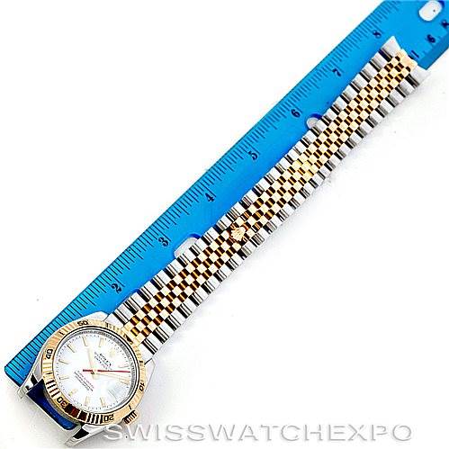 The image shows a Rolex Turn-o-Graph 116263 Men's Stainless Steel White Dial 116263 Men's Stainless Steel White Dial watch laid flat next to a ruler, displaying its face and full metal bracelet.