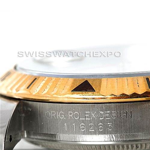 This image shows a close-up of the bezel and part of the casing of a Rolex Turn-o-Graph 116263 Men's Stainless Steel White Dial 116263 Men's Stainless Steel White Dial model, highlighting its design details.