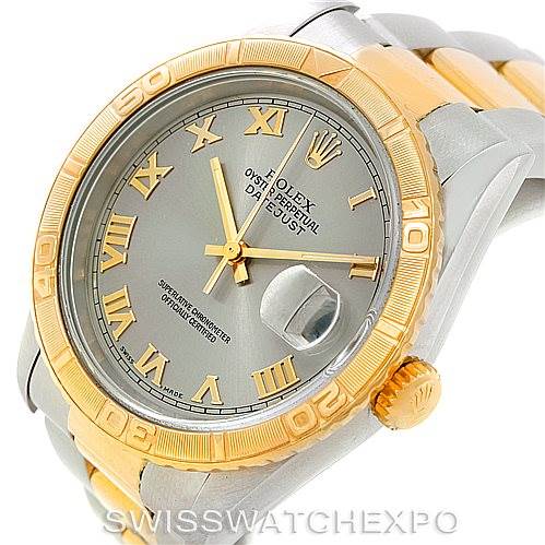 The image shows a Rolex Turn-o-Graph 16263 Men's Steel and Gold (two tone) Grey Dial 16263 Men's Steel and Gold (two tone) Grey Dial watch angled slightly from the side, highlighting the gold bezel, grey dial, and dual-tone band.