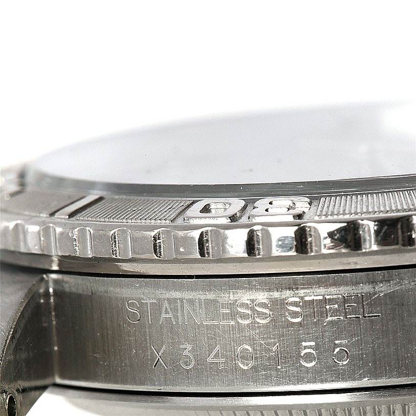 The image shows a close-up side view of the bezel and case part of a Rolex Turn-o-Graph 16264 Men
s Stainless Steel Grey Dial 16264 Men
s Stainless Steel Grey Dial model, highlighting its stainless steel engraving.