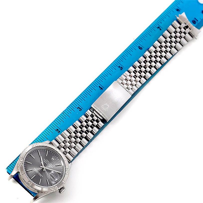 The Rolex Turn-o-Graph 16264 Men
s Stainless Steel Grey Dial 16264 Men
s Stainless Steel Grey Dial watch is shown from a top-down angle, featuring the bezel, dial, and metal bracelet.