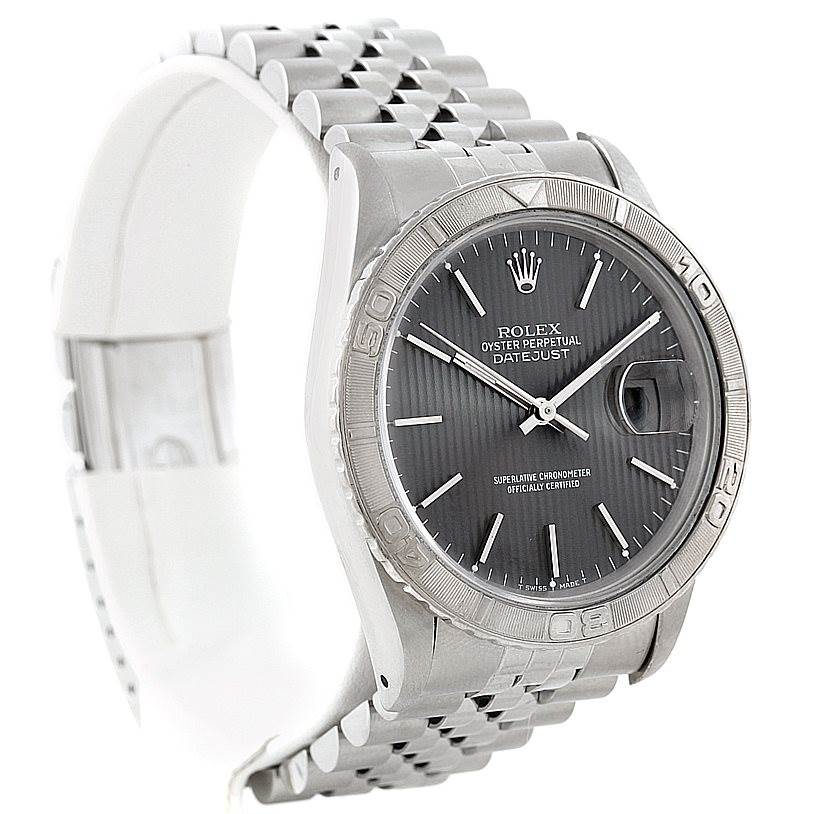 The image shows a Rolex Turn-o-Graph 16264 Men
s Stainless Steel Grey Dial 16264 Men
s Stainless Steel Grey Dial watch from an angled view, highlighting its bezel, dial, hands, and bracelet.