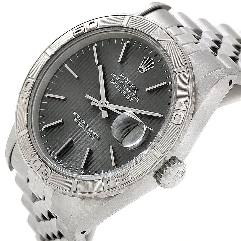 This image shows a Rolex Turn-o-Graph 16264 Men
s Stainless Steel Grey Dial 16264 Men
s Stainless Steel Grey Dial watch from a tilted angle, highlighting its face, bezel, and bracelet.