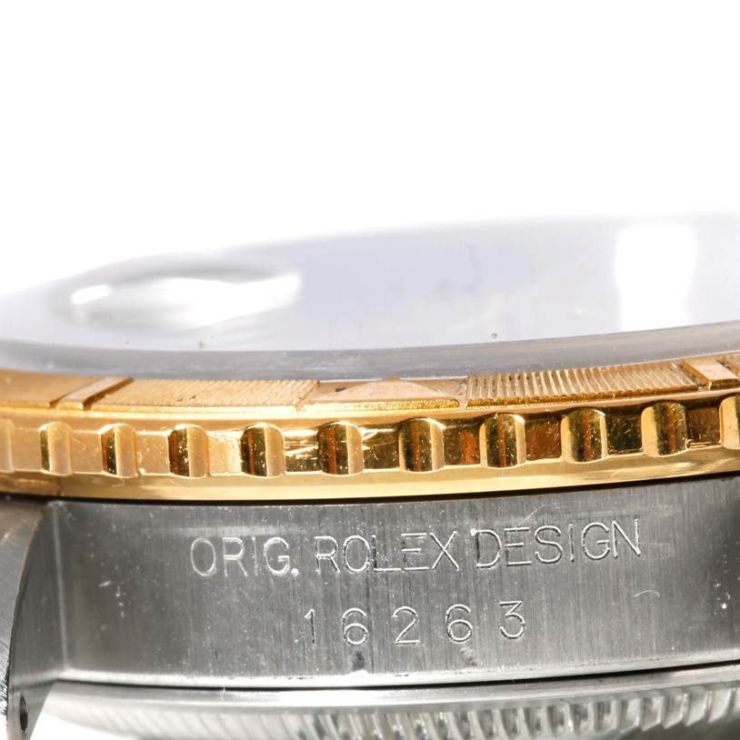 The image shows a close-up side view of a Rolex Turn-o-Graph 16263 Men's Steel and Gold (two tone) Beige Dial 16263 Men's Steel and Gold (two tone) Beige Dial model, highlighting the bezel, crystal, and serial number engraving.