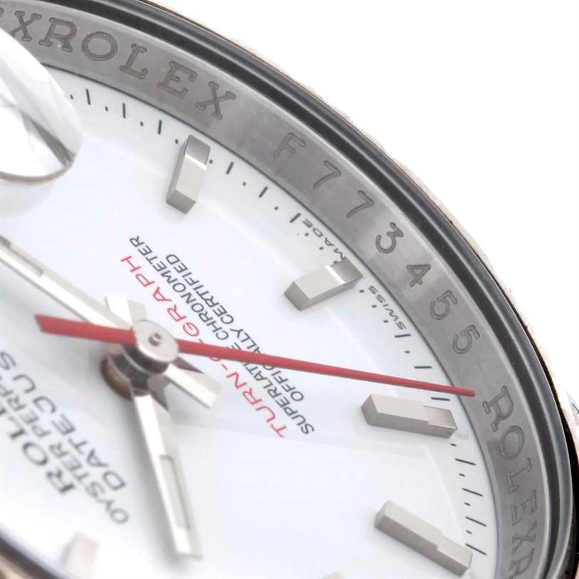 The image shows a close-up of the dial, hands, and bezel of a Rolex Turn-o-Graph 116264 Men
s Stainless Steel White Dial 116264 Men
s Stainless Steel White Dial watch, focusing on its branding and detailing.