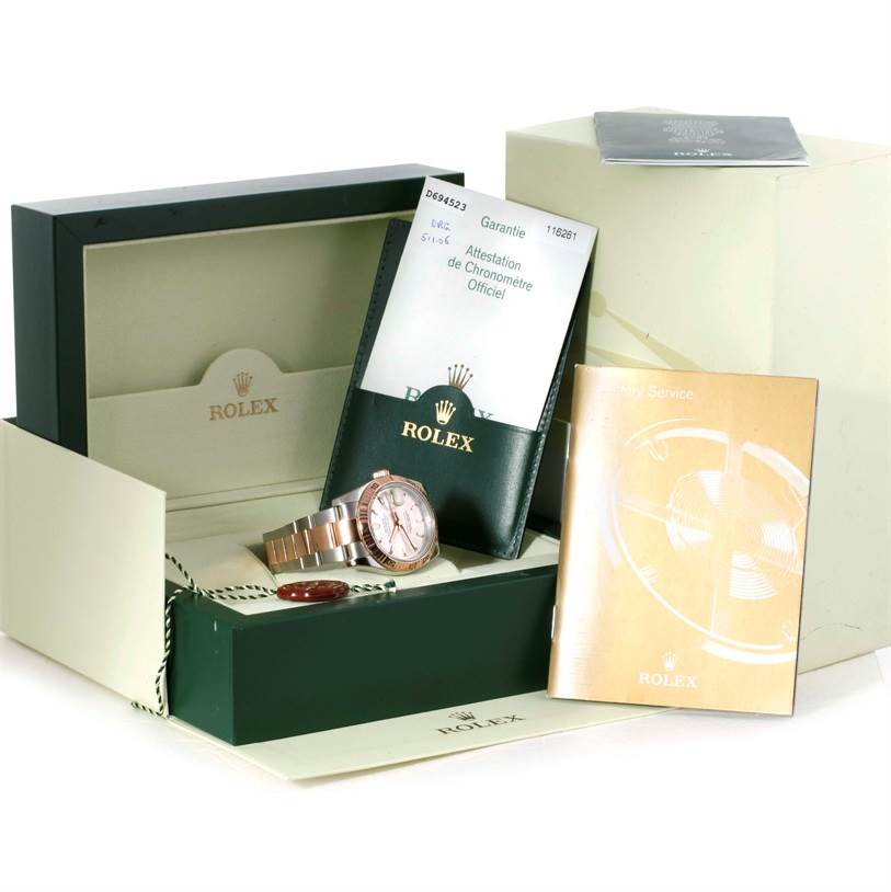 The image shows a Rolex Turn-o-Graph 116261 Men
s Stainless Steel Silver Dial 116261 Men
s Stainless Steel Silver Dial watch, its box, manuals, tags, and warranty card from a front angle.