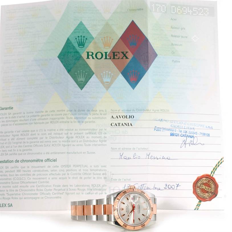 The image shows a Rolex Turn-o-Graph 116261 Men
s Stainless Steel Silver Dial 116261 Men
s Stainless Steel Silver Dial watch and its warranty certificate.