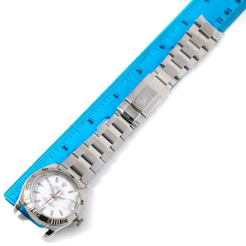 The image shows a Rolex Turn-o-Graph 116264 Men's Stainless Steel White Dial 116264 Men's Stainless Steel White Dial watch laid flat, with a ruler measuring its length.