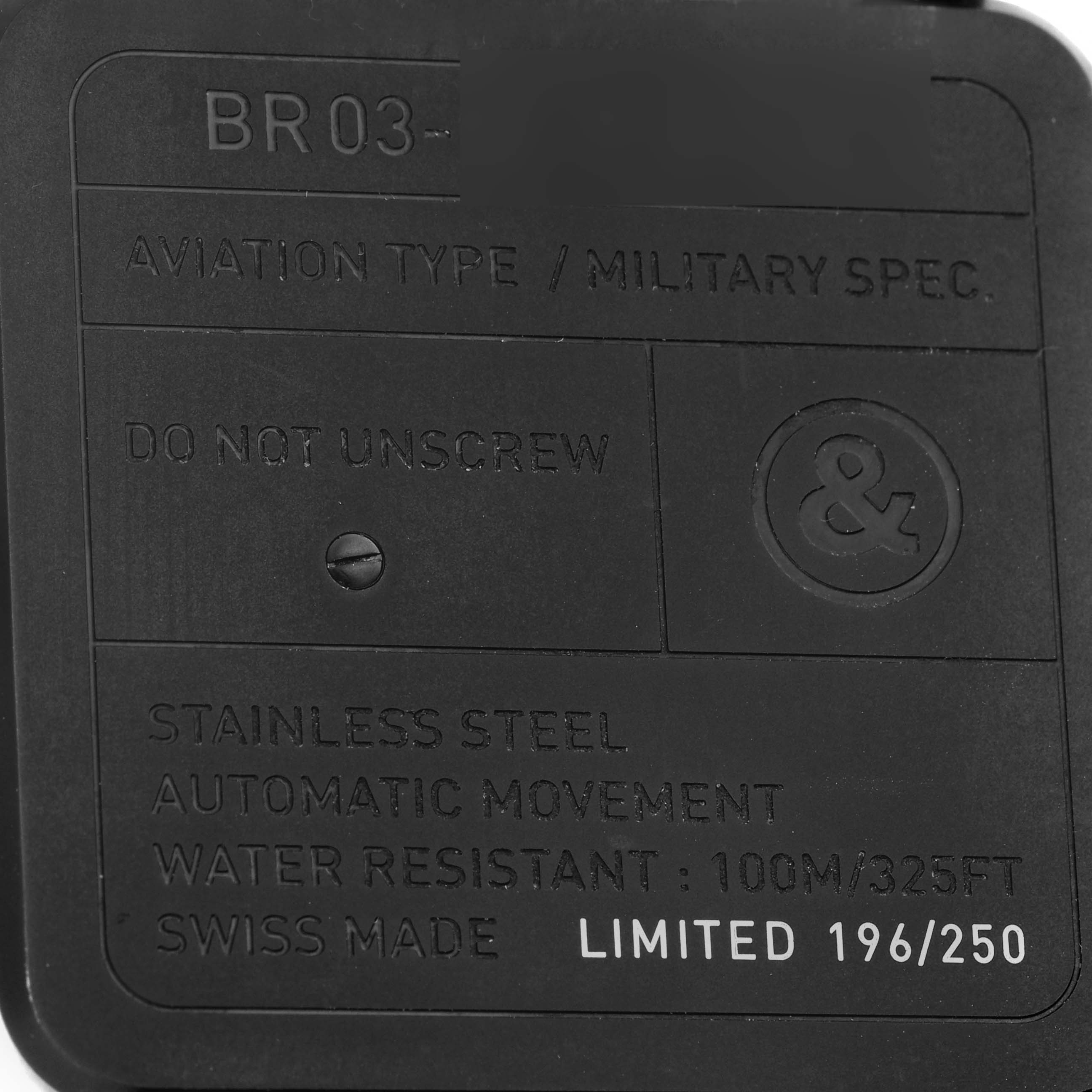 The image shows the back of a Bell 
Ross Instruments BR03-92-S Men
s Stainless Steel Black Dial BR03-92-S Men
s Stainless Steel Black Dial model BR03, displaying specifications and a limited edition number.