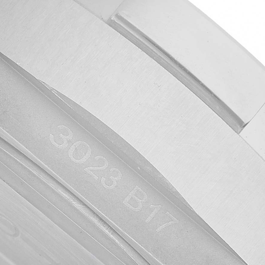 The image shows a close-up of the side of a Breitling Avenger A32320 Men's Stainless Steel Blue Dial watch, with visible engraving "3023 B17".