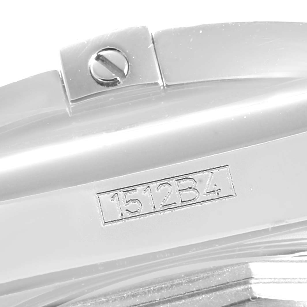 This close-up shows the side of the Breitling Chronomat AB0141 Men
s Stainless Steel Black Dial AB0141 Men
s Stainless Steel Black Dial watch, featuring the serial number and part of the case screw.