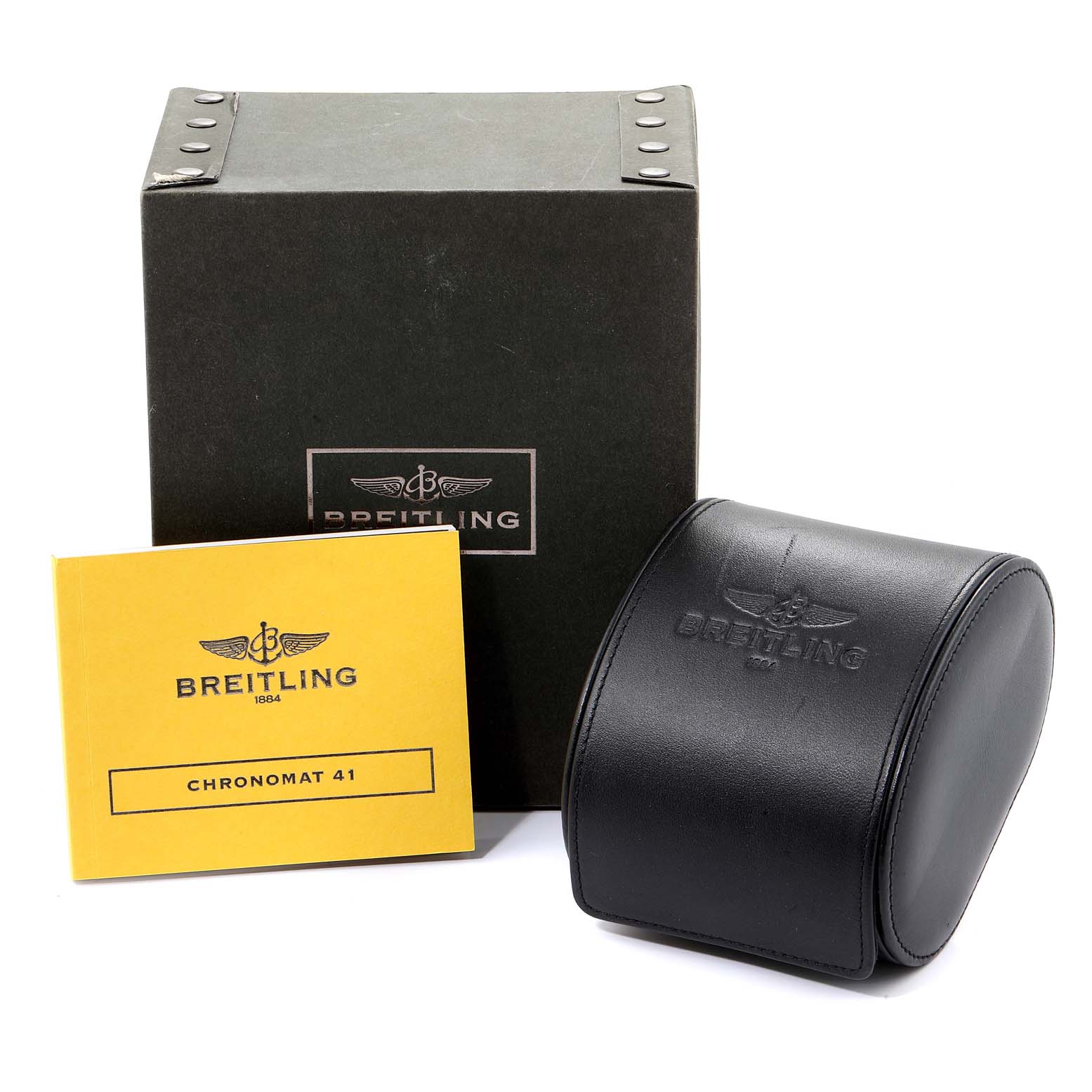 This image shows the box, manual, and leather case for the Breitling Chronomat AB0141 Men
s Stainless Steel Black Dial AB0141 Men
s Stainless Steel Black Dial model.