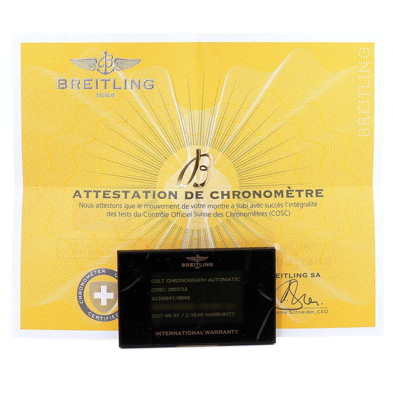 The image shows a Breitling Colt A13388 Men's Stainless Steel Black Dial A13388 Men's Stainless Steel Black Dial model chronometer certificate and an international warranty card.