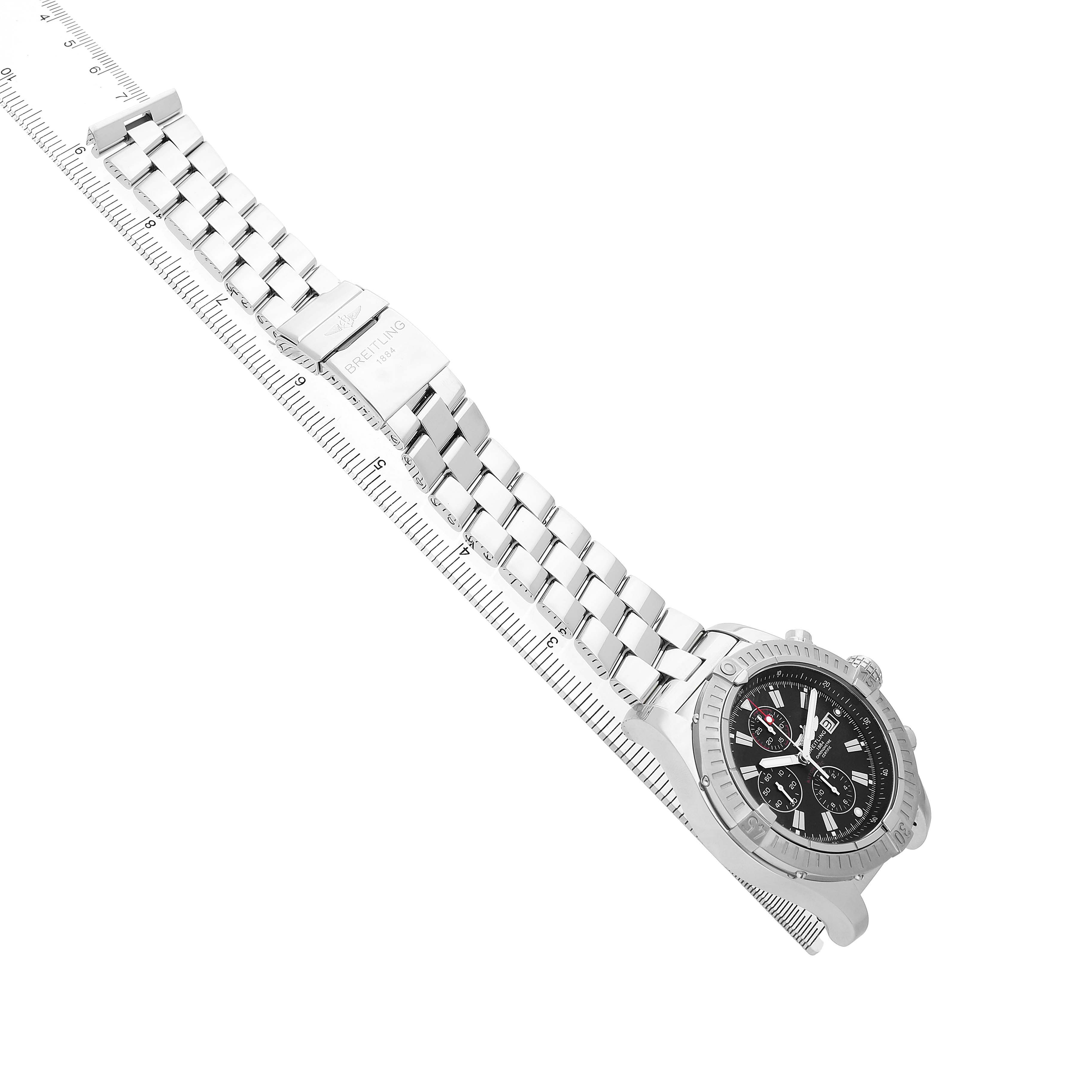 The image shows the Breitling Avenger A13370 Men's Stainless Steel Black Dial watch at a side angle, highlighting the bracelet and clasp aligned with a ruler for scale.