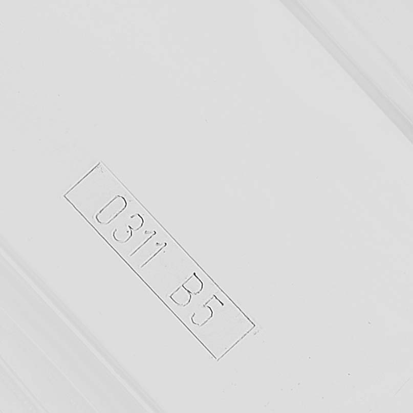 The image shows a close-up of the packaging with the code "0311 B5," likely related to the Breitling Avenger A13370 Men's Stainless Steel Black Dial model accessories.