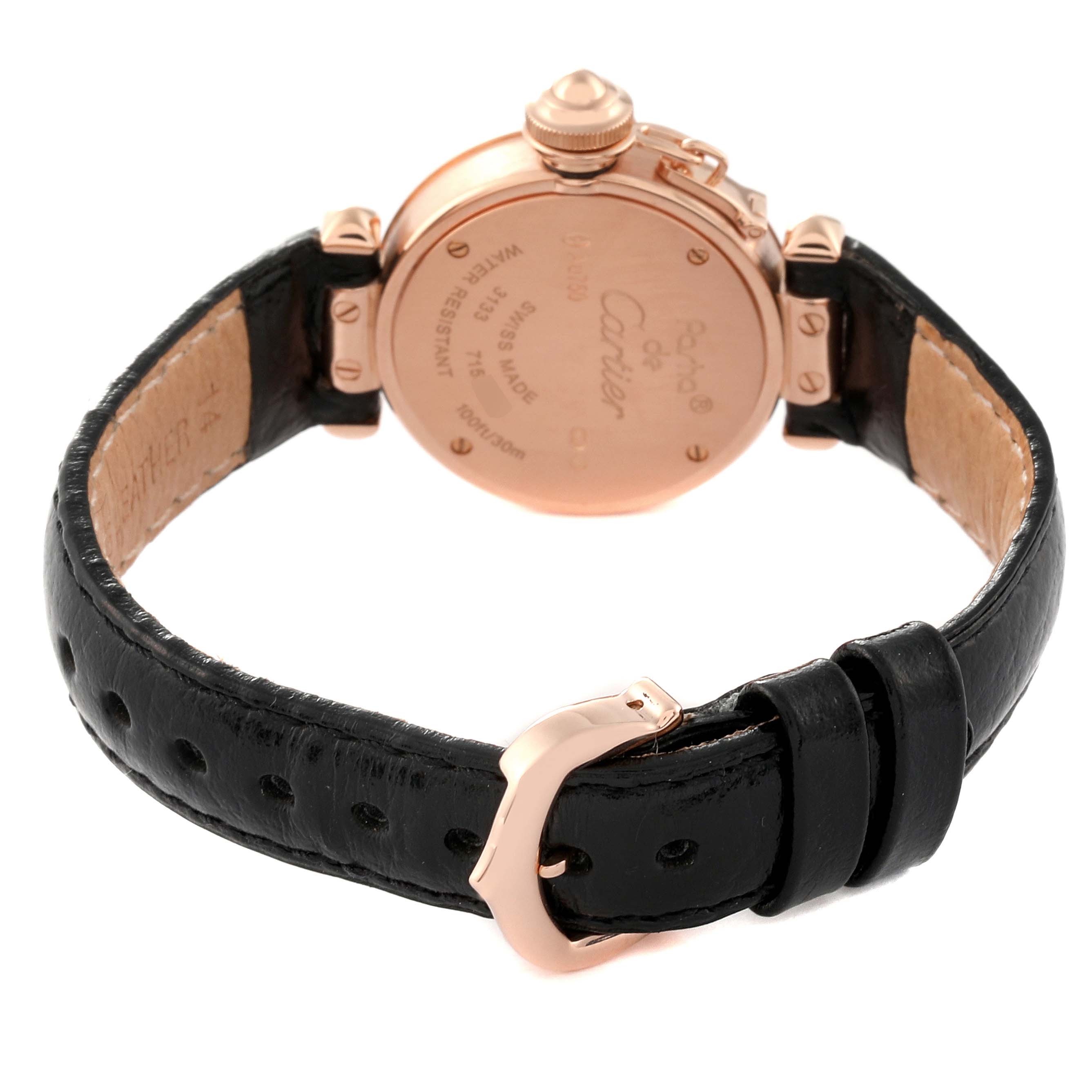 This image shows the back of a Cartier Pasha WJ124028 Women's Rose Gold Silver Dial WJ124028 Women's Rose Gold Silver Dial watch and its black leather strap with a rose gold buckle.