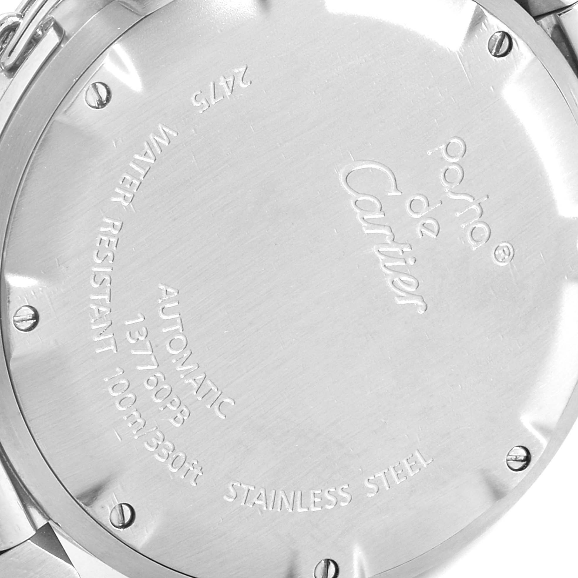 This image shows the back case of a Pasha model by Cartier, featuring engravings and screws.