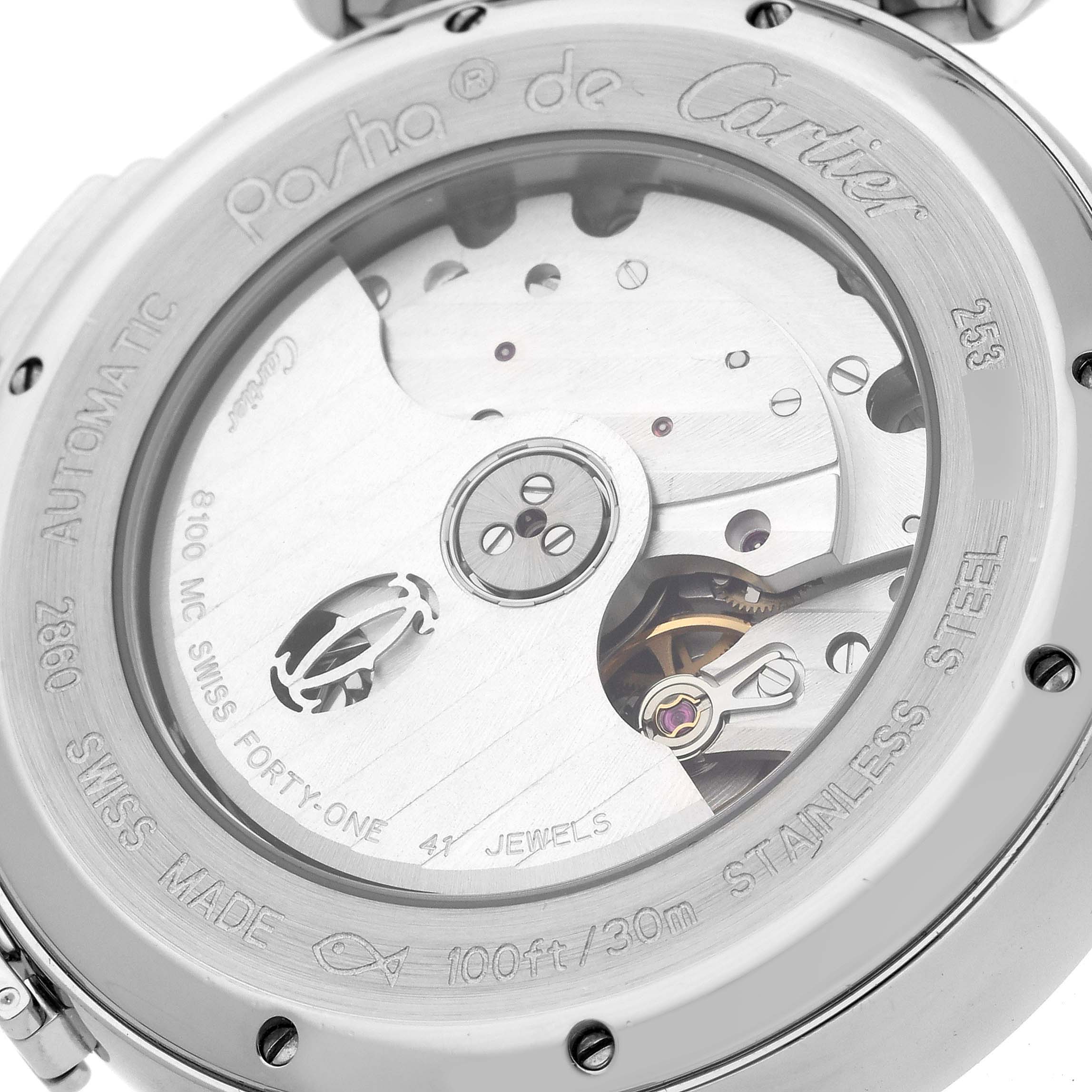 This image shows a close-up of the case back of the Pasha by Cartier, highlighting the automatic movement and intricate mechanics.