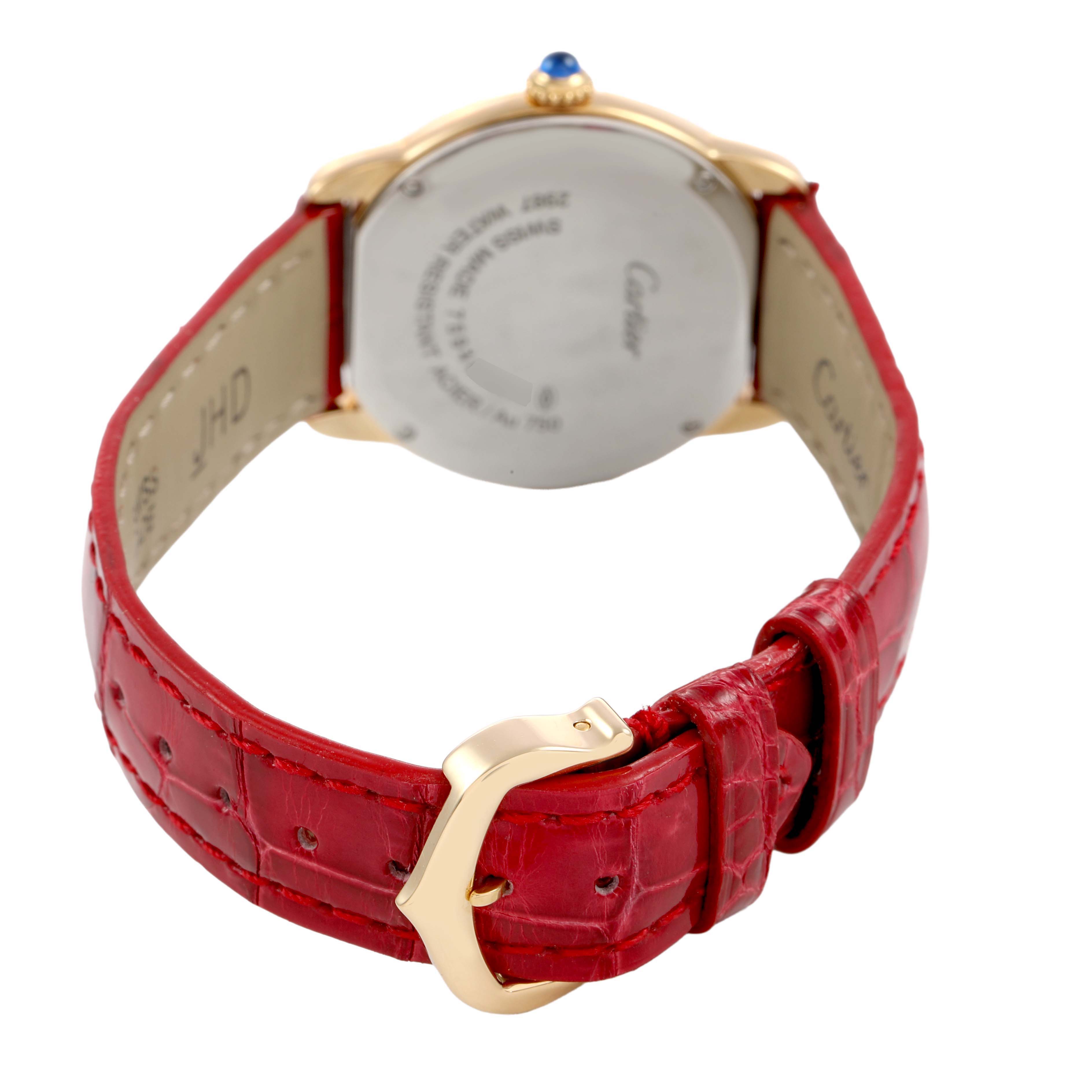 The image shows the back of the Cartier Ronde W6700355 Women's Yellow Gold Silver Dial model, highlighting the case back, crown, and red leather strap with a gold buckle.
