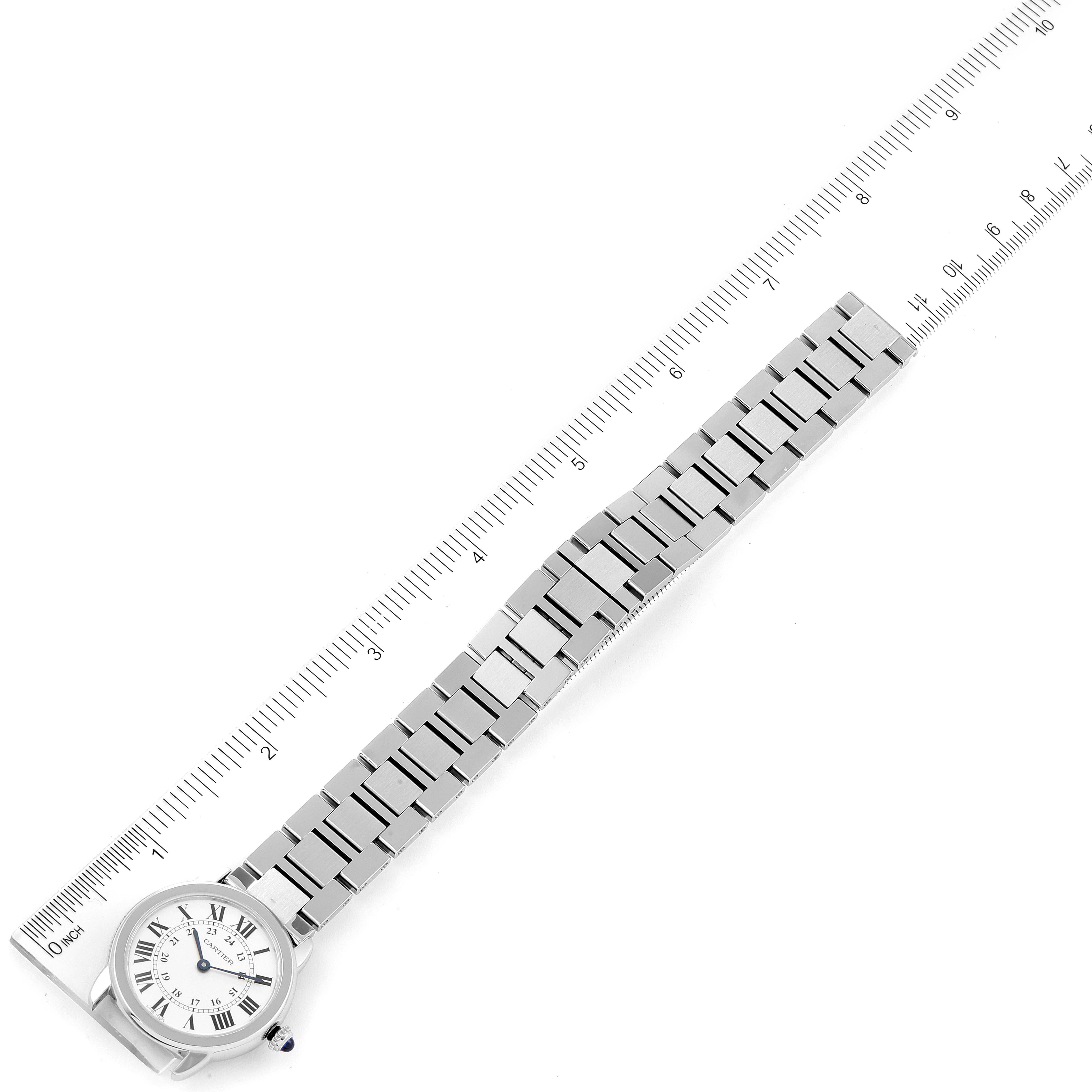 This top-down view shows the entire Cartier Ronde W6701004 Women's Stainless Steel Silver Dial W6701004 Women's Stainless Steel Silver Dial model watch next to a ruler for measurement.