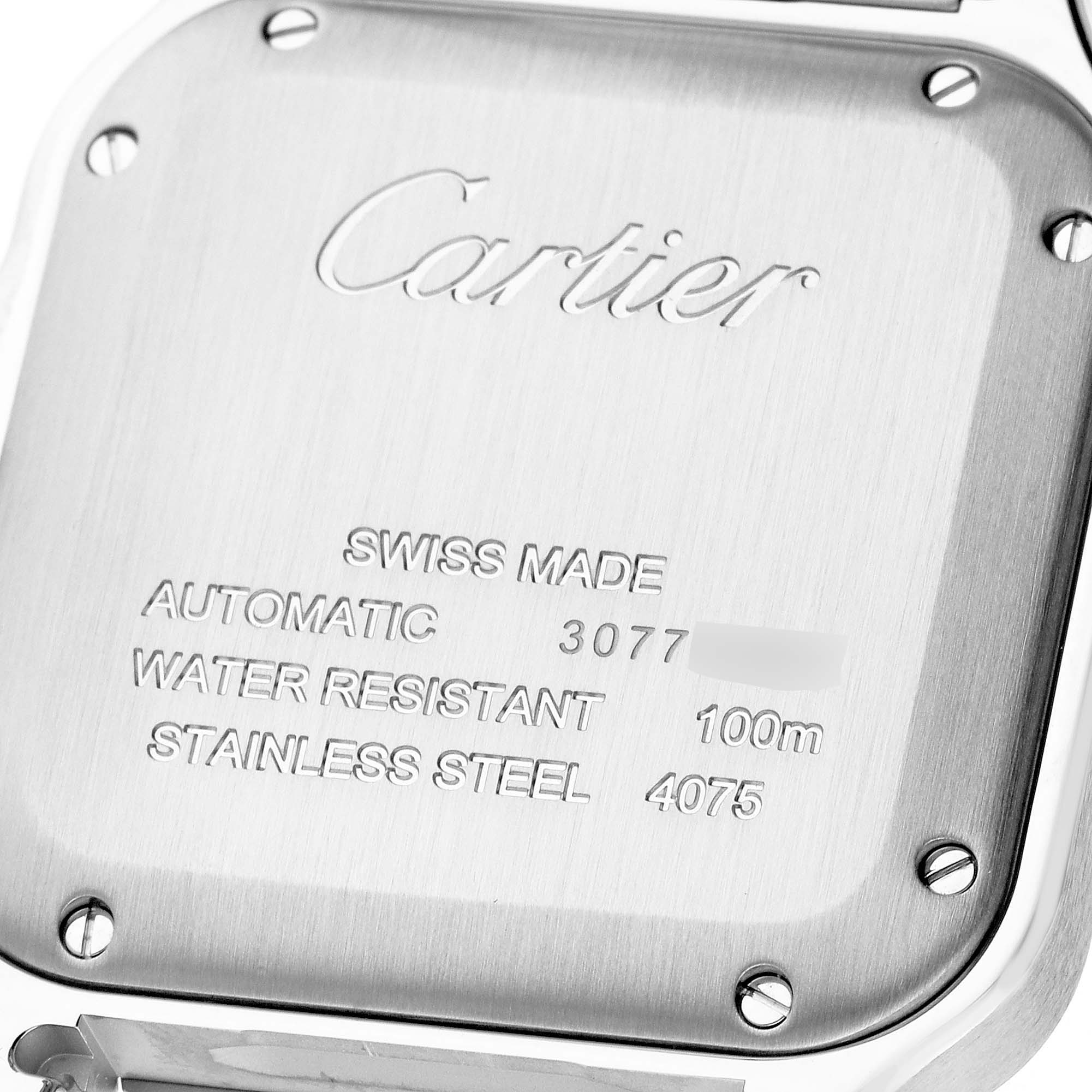 This image shows the back case of a Cartier Santos W4SA0006 Men's Stainless Steel Blue Dial W4SA0006 Men's Stainless Steel Blue Dial watch, highlighting the engraved details and screws.