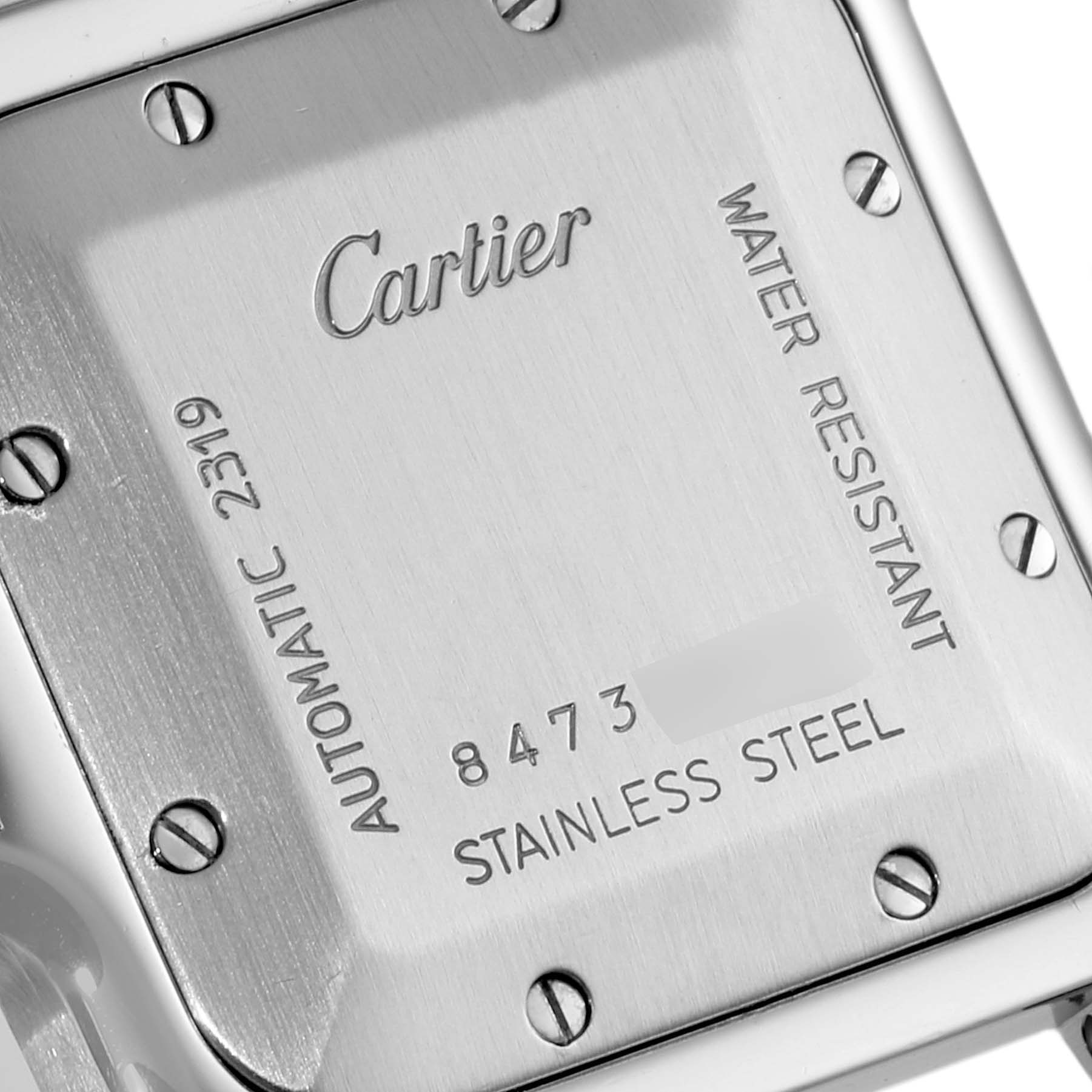 The image shows a close-up of the back case of a Cartier Santos W20040D6 Men
s Stainless Steel Silver Dial W20040D6 Men
s Stainless Steel Silver Dial watch.