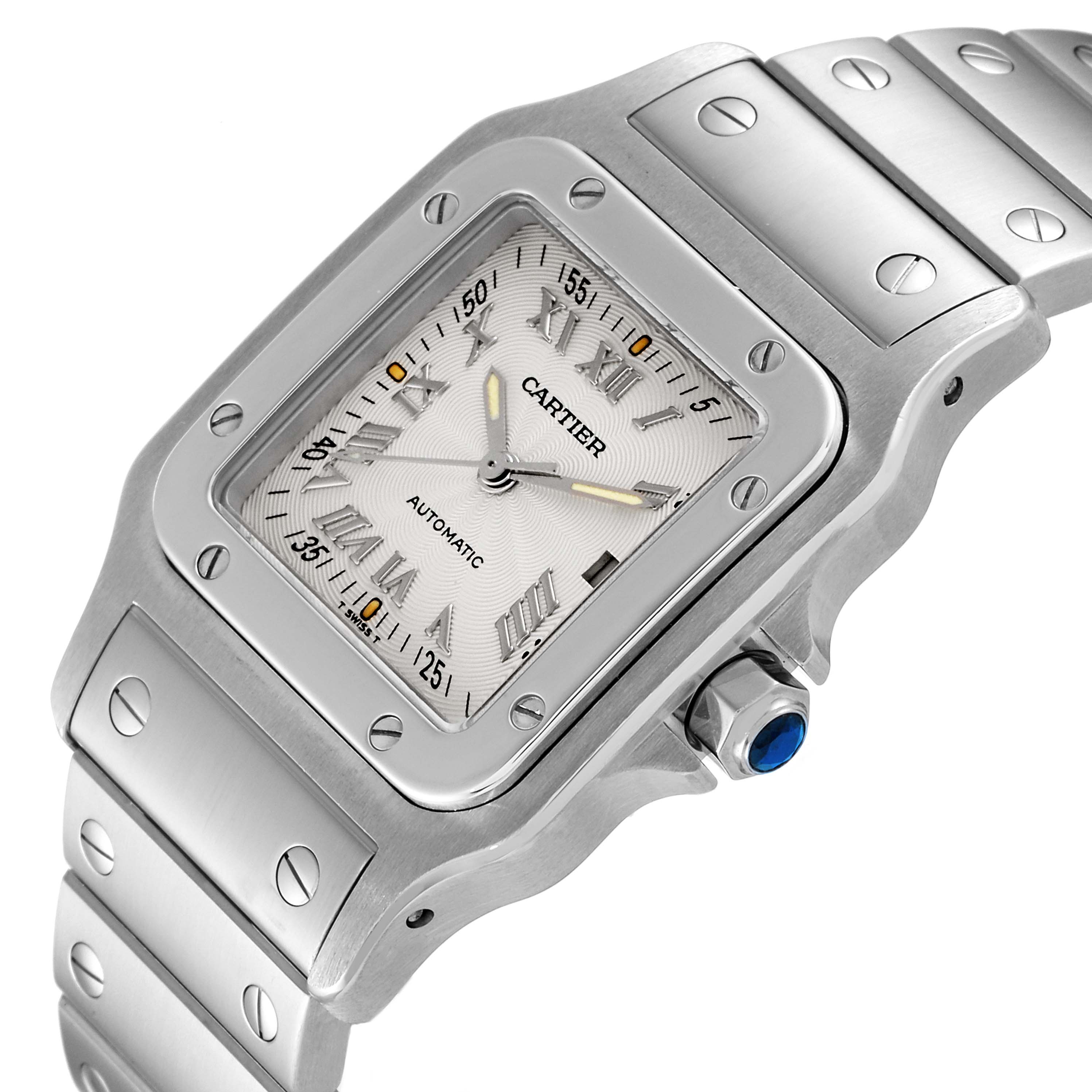 This image displays a close-up, angled view of the dial and metal bracelet of a Cartier Santos W20040D6 Men
s Stainless Steel Silver Dial W20040D6 Men
s Stainless Steel Silver Dial watch.