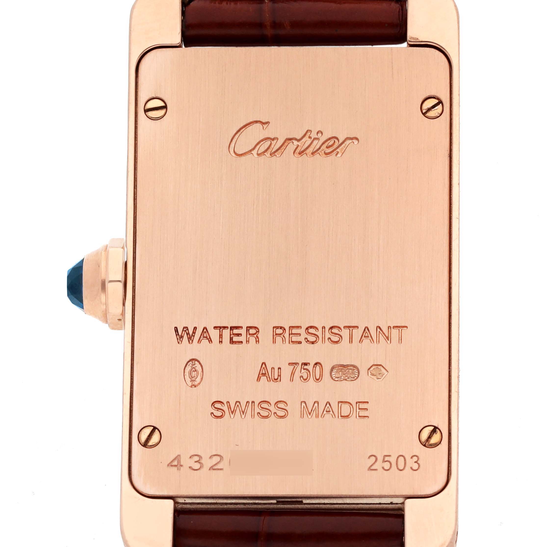 This image shows the back of a Cartier Tank Americaine W2607456 Women's Rose Gold Silver Dial W2607456 Women's Rose Gold Silver Dial watch, highlighting the brand name, water resistance, and Swiss made markings.
