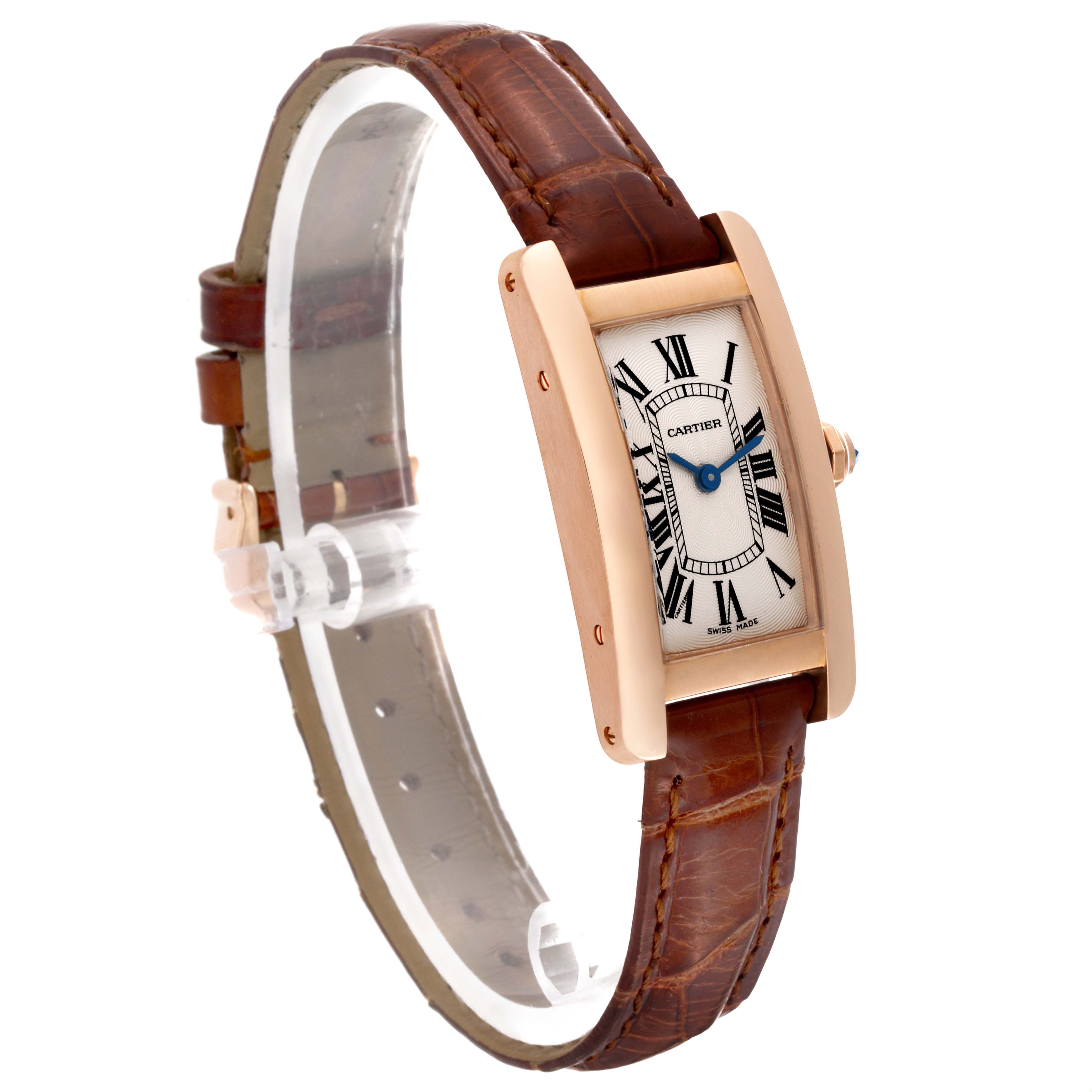 The Cartier Tank Americaine W2607456 Women's Rose Gold Silver Dial W2607456 Women's Rose Gold Silver Dial watch is shown from a three-quarter angle, highlighting the face, case, and brown leather strap.
