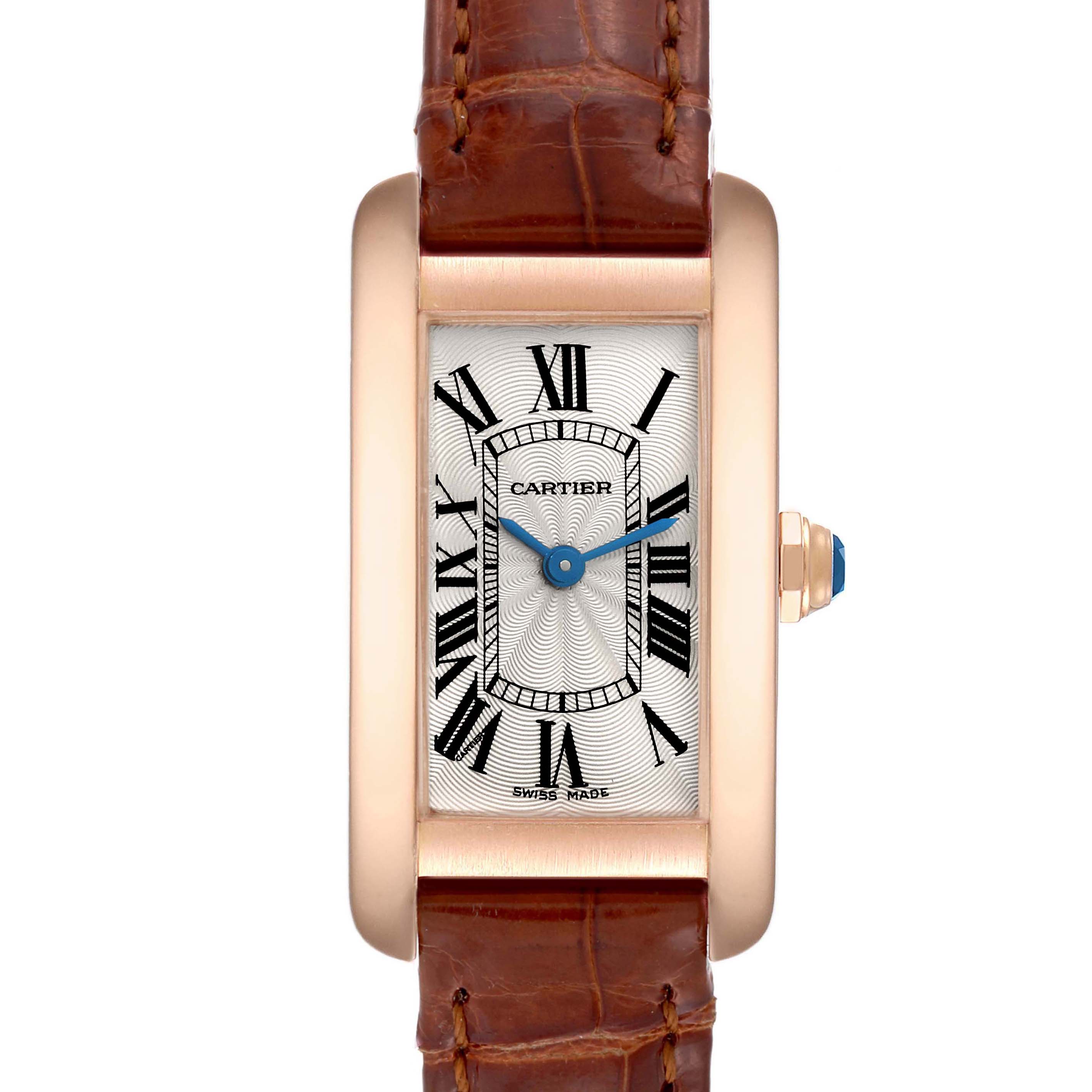 The image shows a front view of a Cartier Tank Americaine W2607456 Women's Rose Gold Silver Dial W2607456 Women's Rose Gold Silver Dial watch with a brown leather strap and a gold rectangular case.