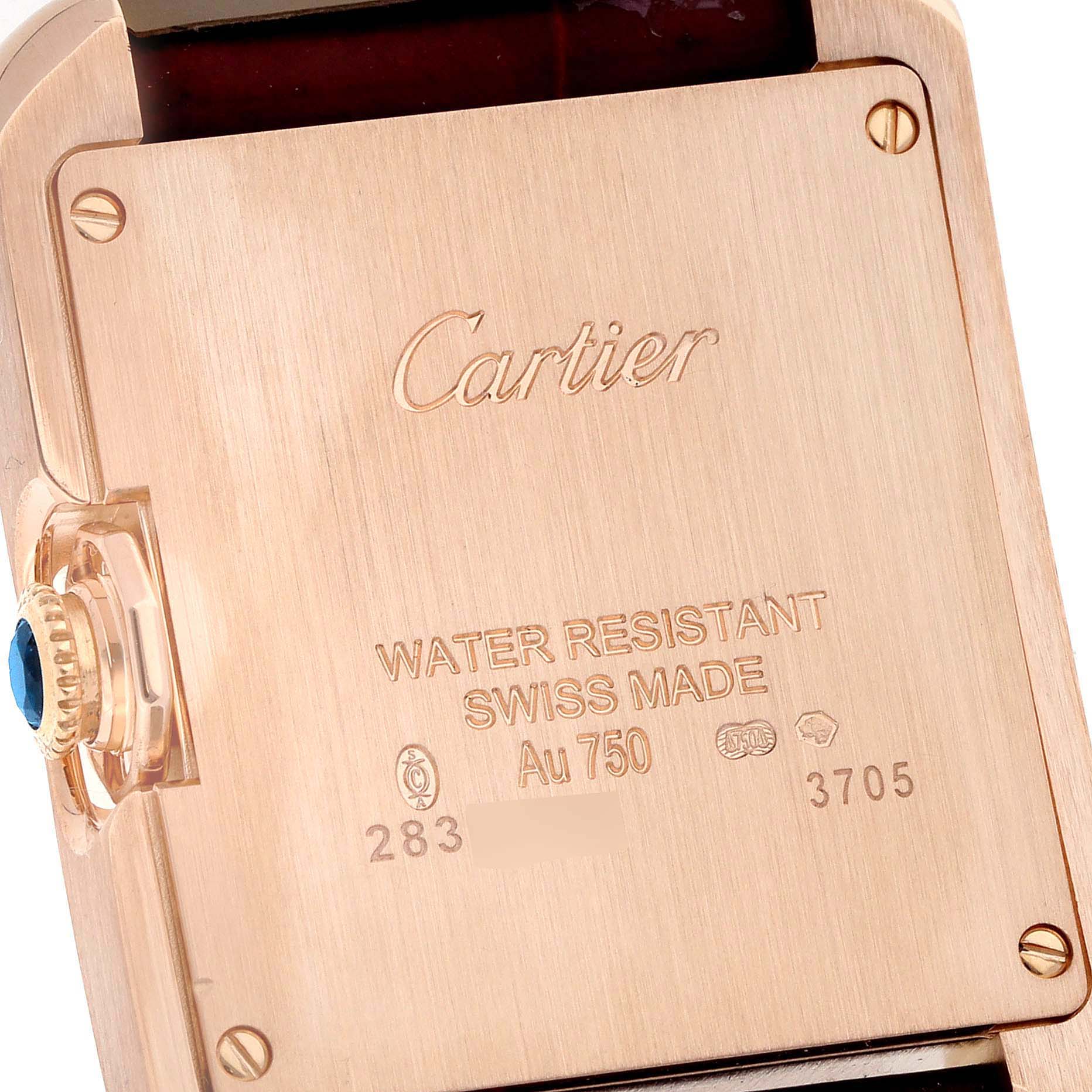 The image shows a close-up of the case back and crown of a Cartier Tank Anglaise WJTA0009 Women
s Rose Gold Silver Dial WJTA0009 Women
s Rose Gold Silver Dial watch.