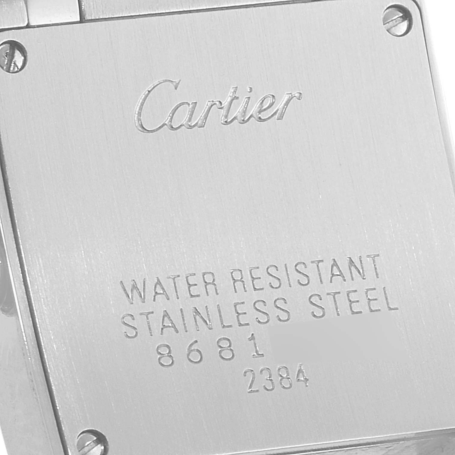 The image shows the back case of a Cartier Tank Francaise W51027Q4 Women
s Steel and Gold (two tone) Mother of Pearl Dial W51027Q4 Women
s Steel and Gold (two tone) Mother of Pearl Dial watch, displaying its stainless steel and water-resistant features.