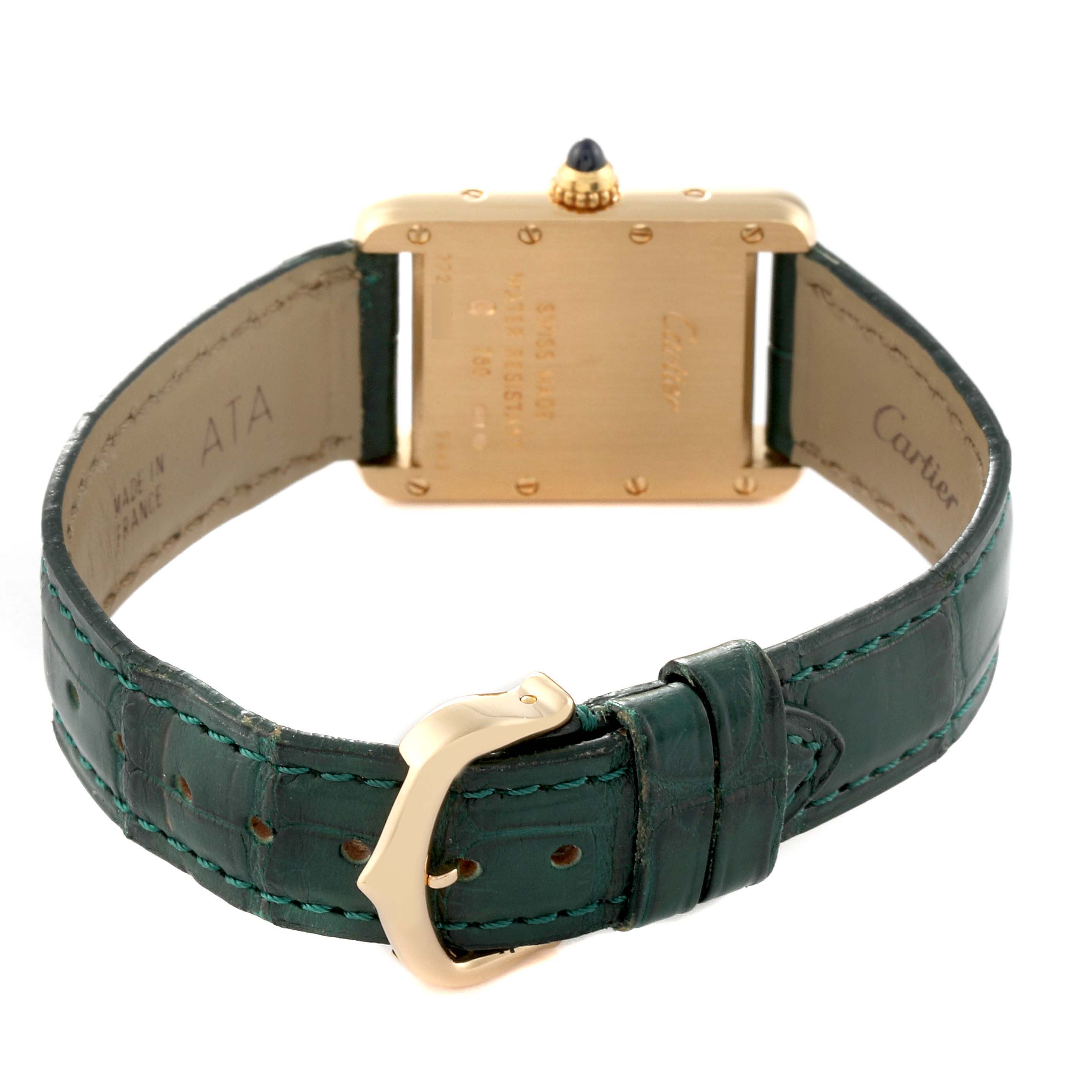 The image shows the back view of the Cartier Tank Louis W1529856 Women's Yellow Gold Silver Dial W1529856 Women's Yellow Gold Silver Dial watch and its green leather strap.