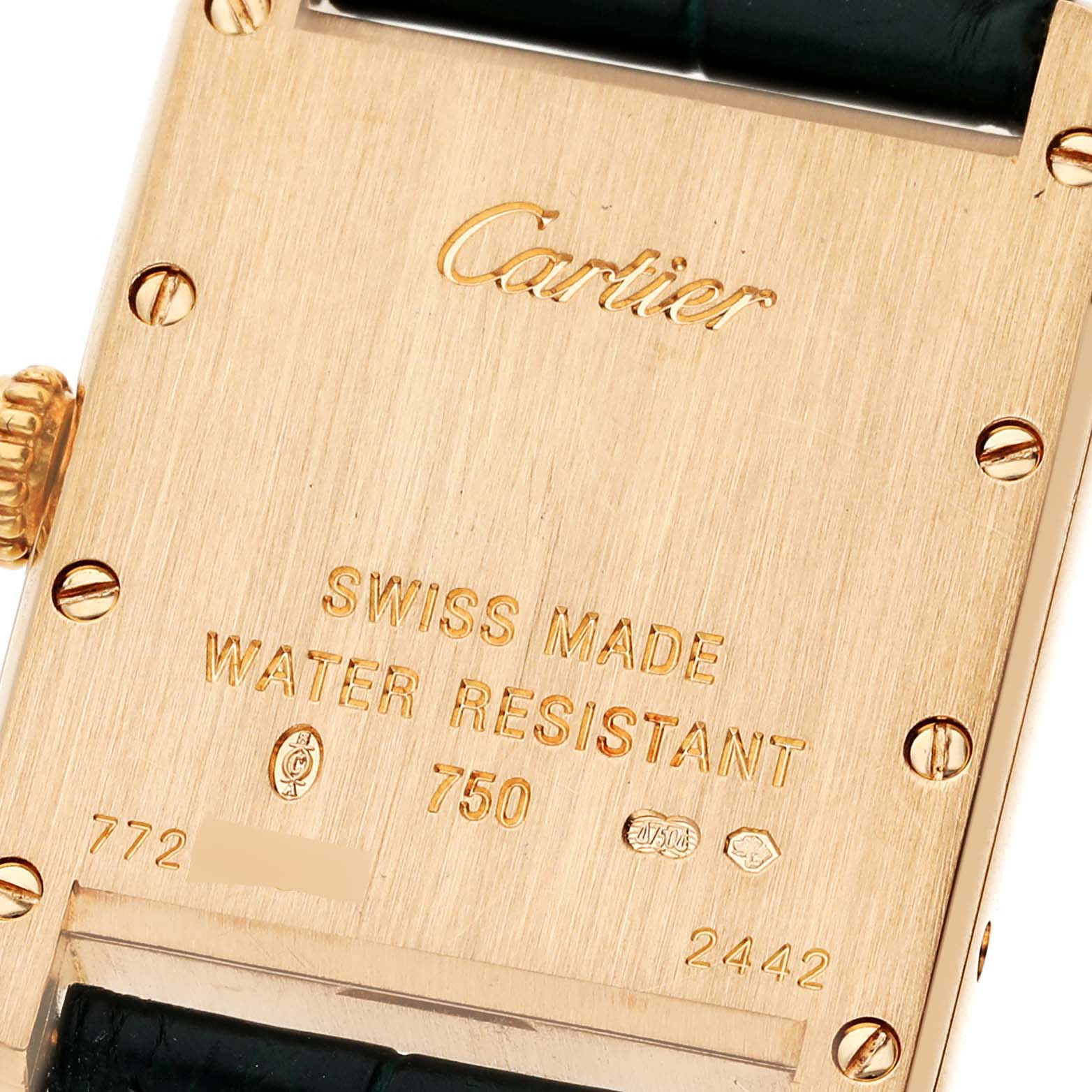 This is a close-up of the back of a Tank Louis model by Cartier, showing the brand name, material details, and water resistance.