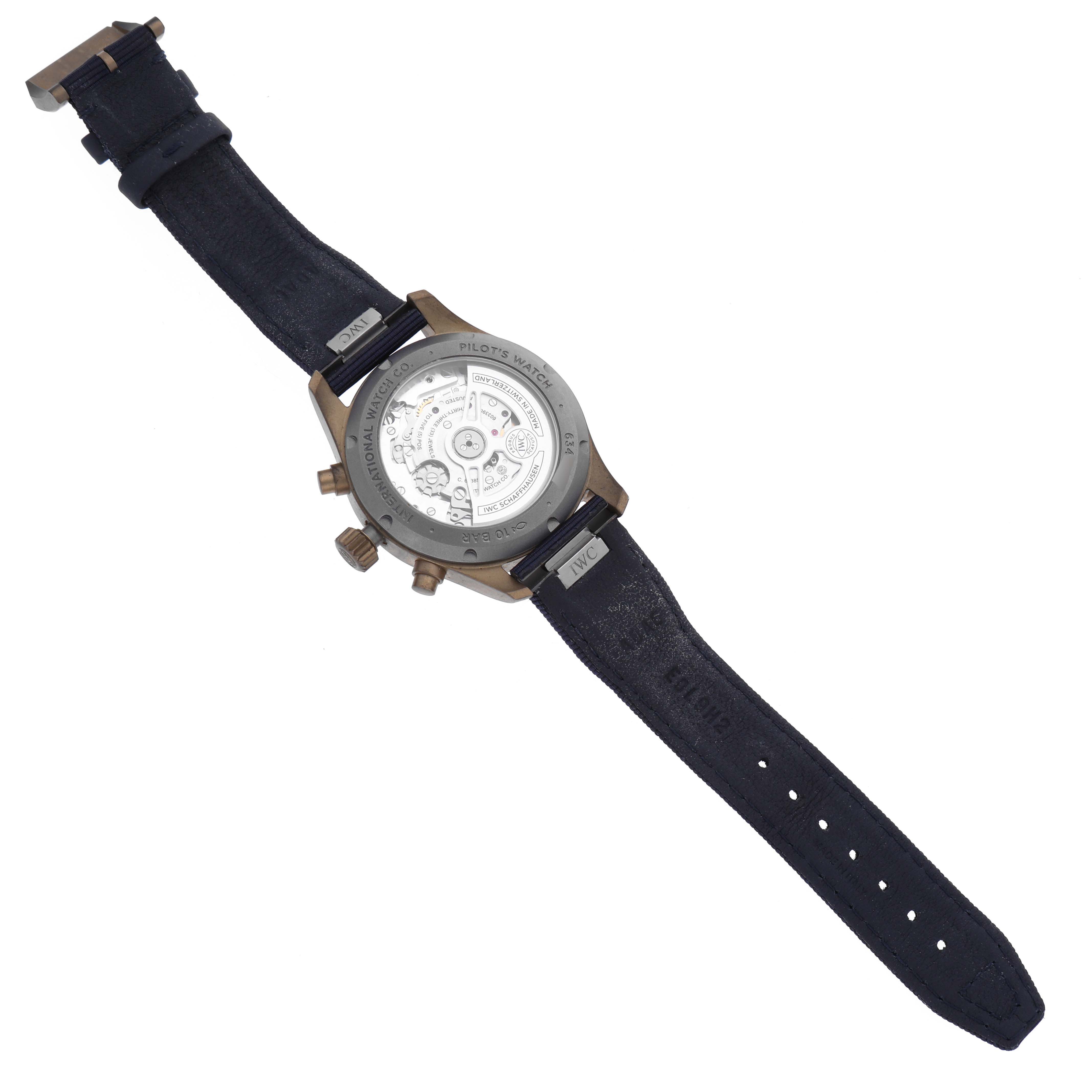 The image shows the back view of the IWC Pilot IW388109 Men's Bronze Blue Dial IW388109 Men's Bronze Blue Dial model watch, displaying its internal mechanisms and strap.