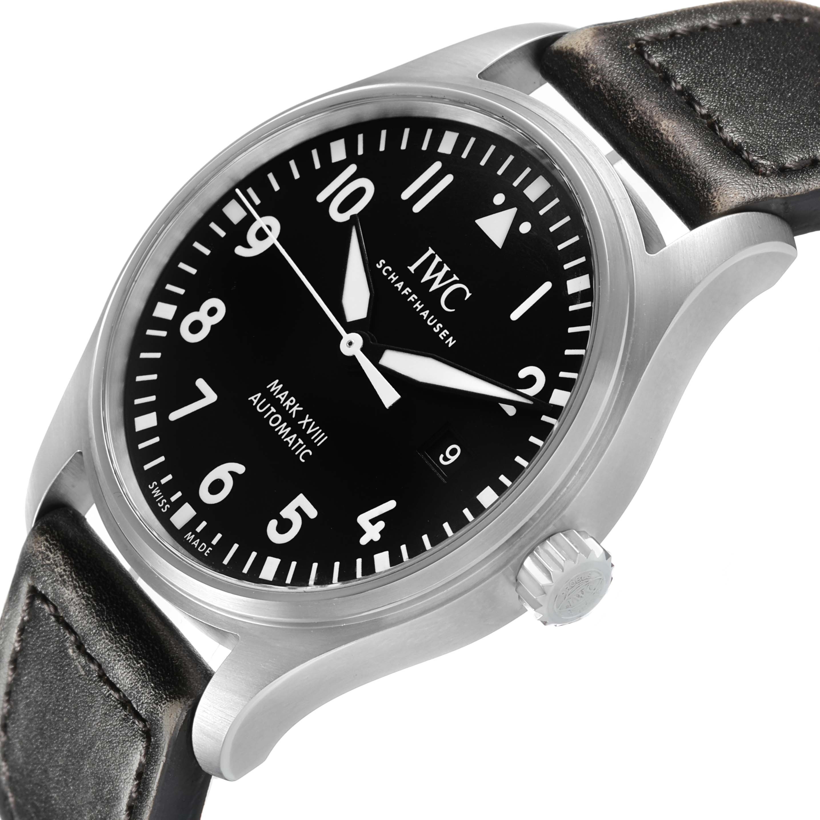 The IWC Pilot IW327001 Men's Stainless Steel Black Dial Mark XVIII watch is shown at a slight side angle, highlighting the dial, bezel, leather strap, and crown.