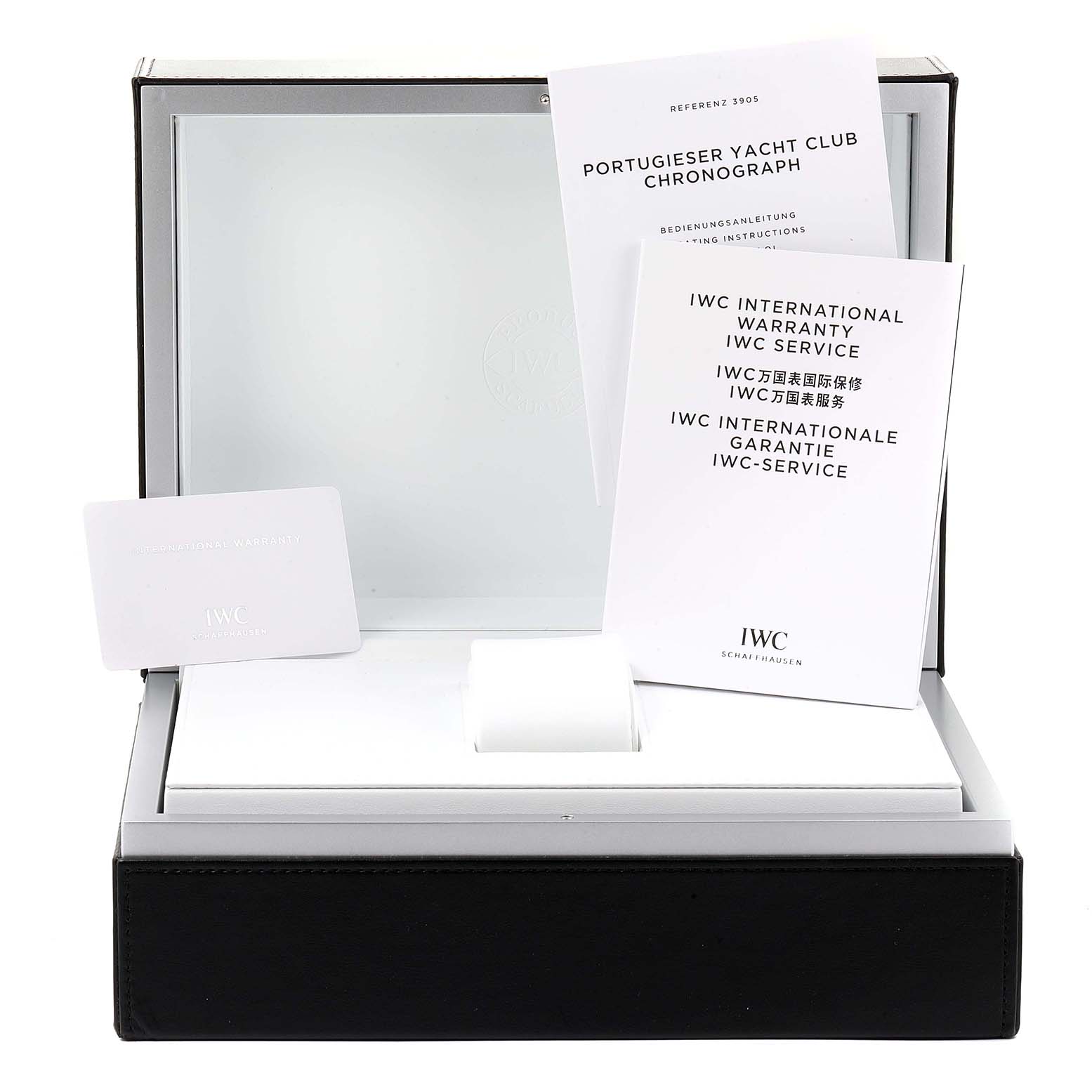 The image shows the opened packaging of an IWC Portuguese IW390209  Men's Rose Gold Grey Dial IW390209  Men's Rose Gold Grey Dial Yacht Club Chronograph with warranty and instruction booklets.