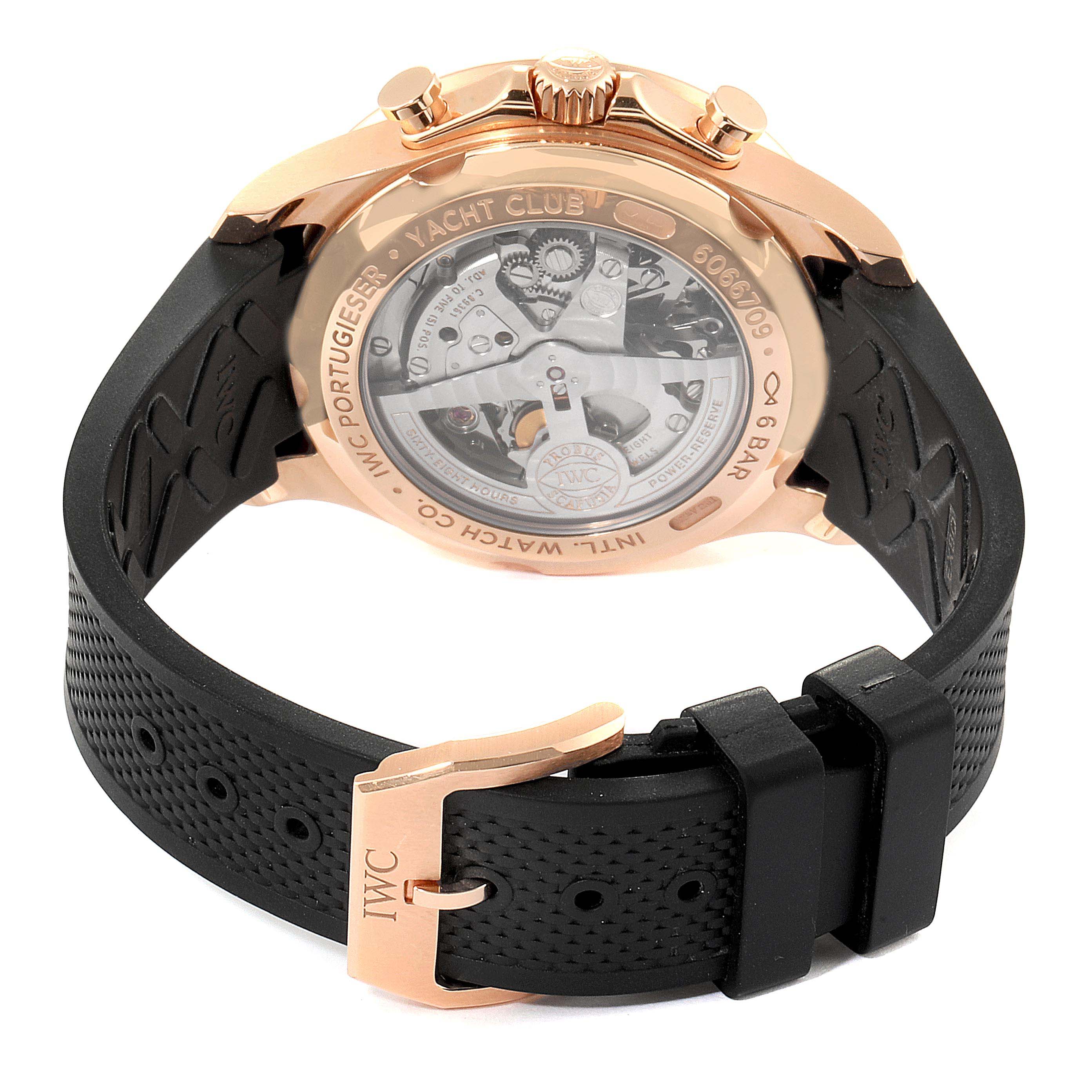 The image shows the back view of the IWC Portuguese IW390209  Men's Rose Gold Grey Dial IW390209  Men's Rose Gold Grey Dial Yacht Club watch, highlighting its movement and black strap with clasp.