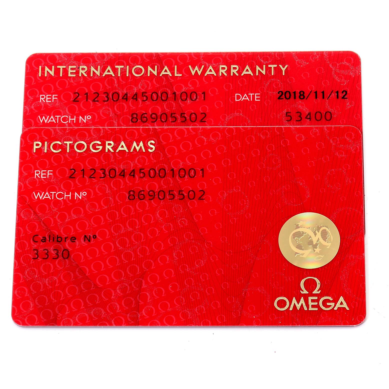 The image shows two Omega cards for a Seamaster model, depicting the international warranty and pictograms.