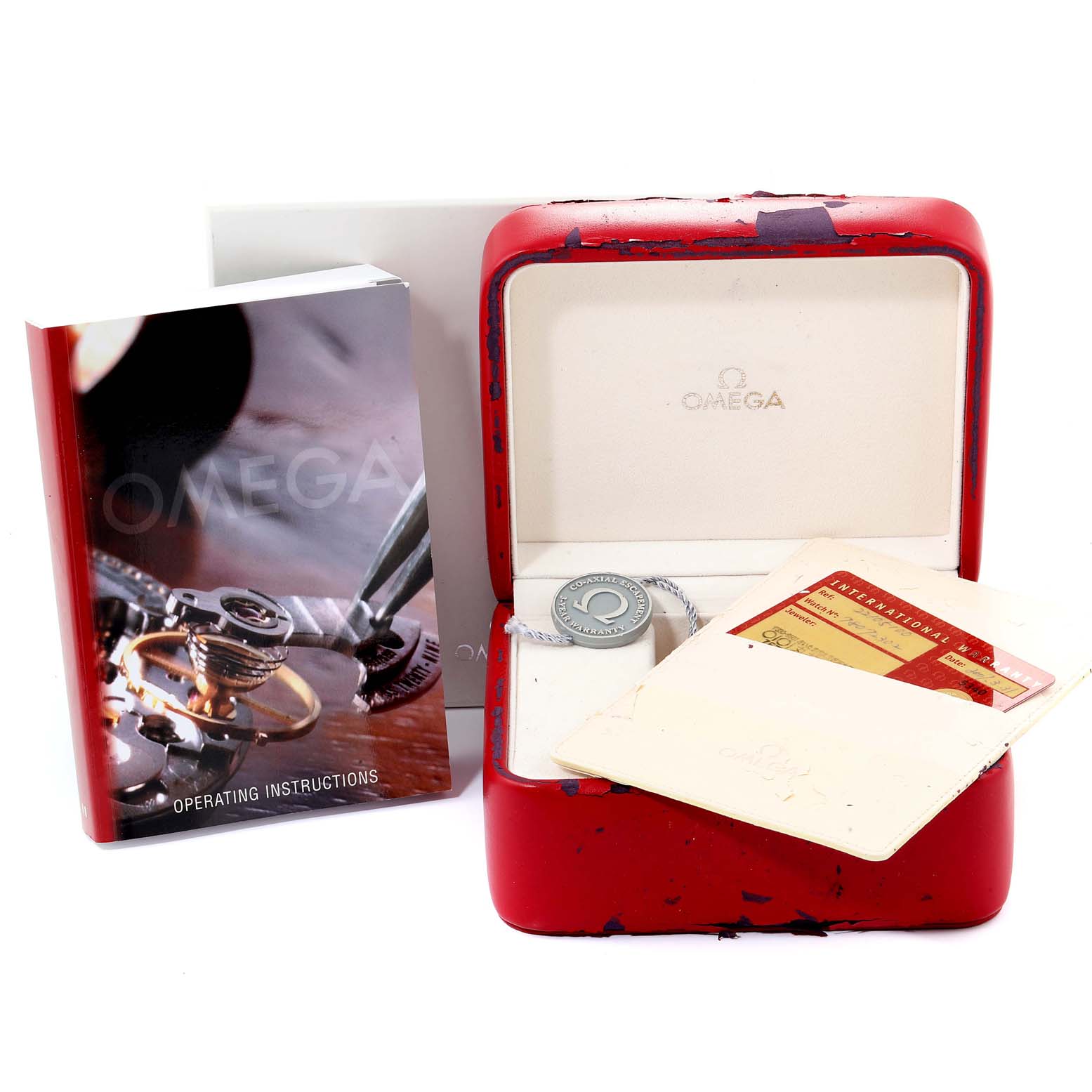 The image shows an Omega Planet Ocean 2210.51.00 Men
s Stainless Steel Black Dial 2210.51.00 Men
s Stainless Steel Black Dial watch box, operating instructions, warranty card, and tag.