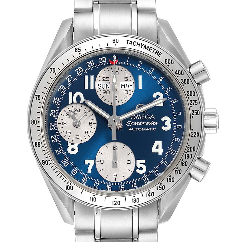 The image shows a frontal view of an Omega Speedmaster watch with a blue dial and silver chronograph subdials.