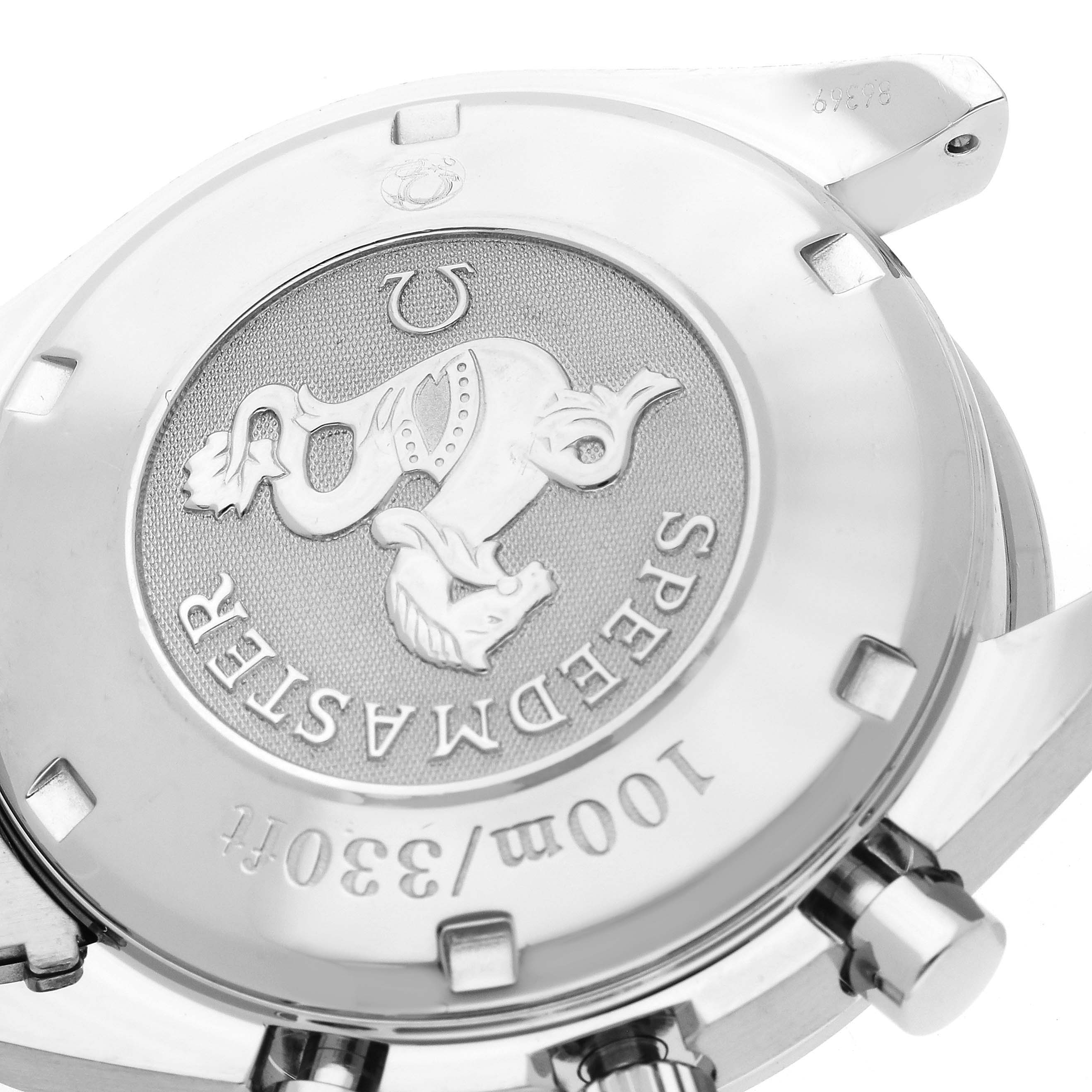 This image shows an angled close-up of the case back inscription and pushers of an Omega Speedmaster 3210.52.00 Men's Stainless Steel Black Dial 3210.52.00 Men's Stainless Steel Black Dial watch.