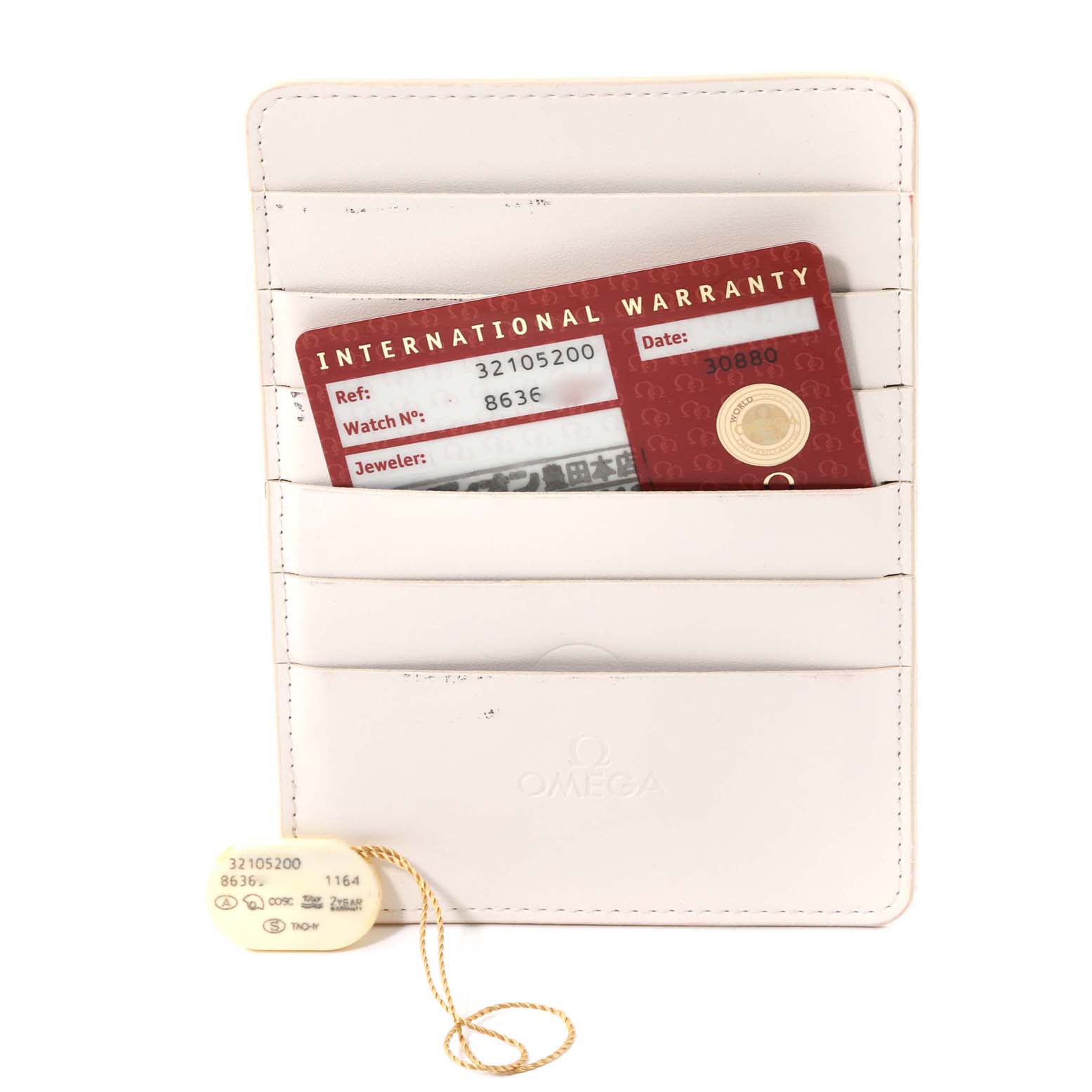 The image shows warranty cards and tags for the Omega Speedmaster 3210.52.00 Men's Stainless Steel Black Dial 3210.52.00 Men's Stainless Steel Black Dial watch model.